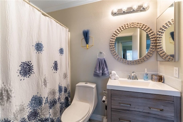 bathroom featuring crown molding, vanity, a shower with shower curtain, and toilet