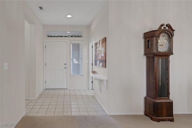 foyer entrance featuring light tile patterned flooring