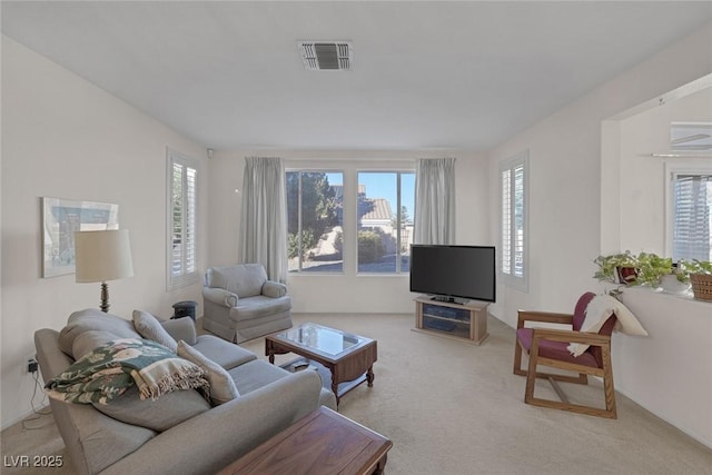 living room featuring light carpet