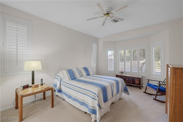 carpeted bedroom with ceiling fan