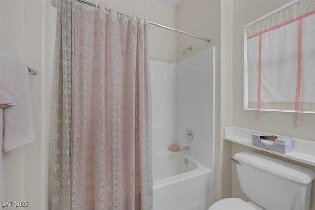 bathroom with toilet and shower / tub combo