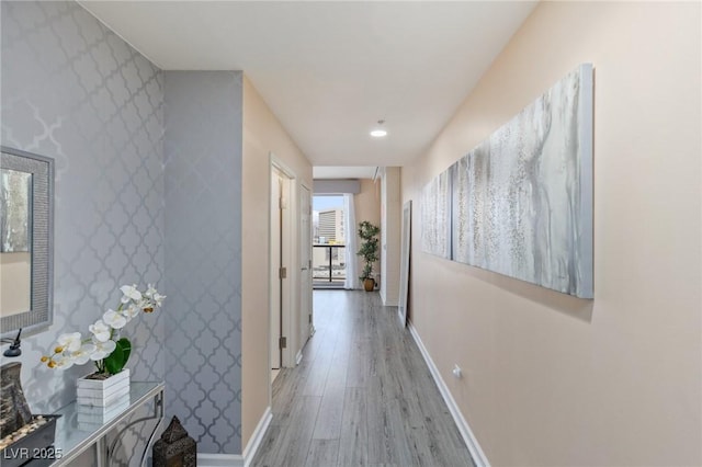 hall with hardwood / wood-style floors