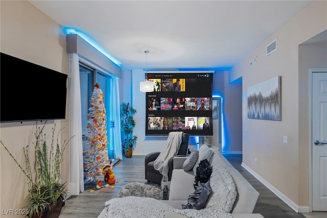 recreation room with hardwood / wood-style floors