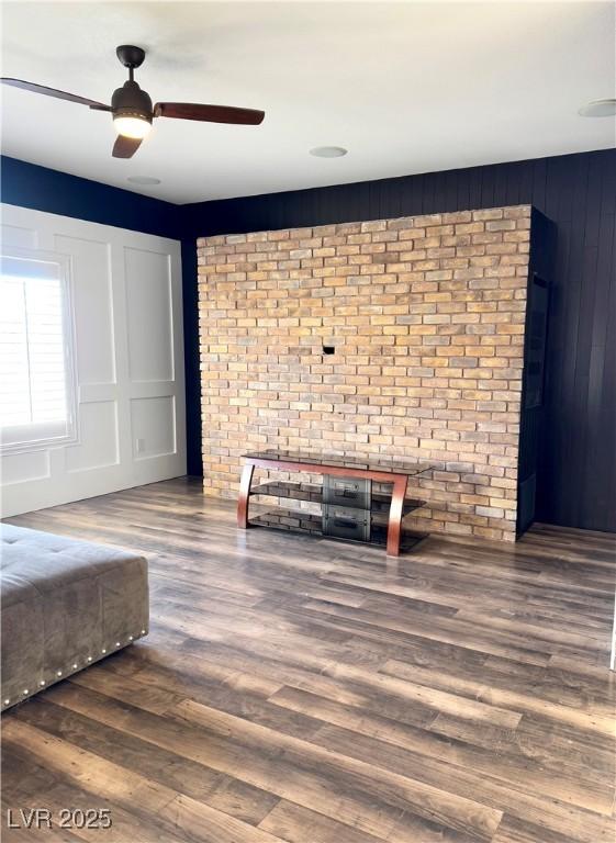 unfurnished bedroom featuring dark hardwood / wood-style floors and ceiling fan