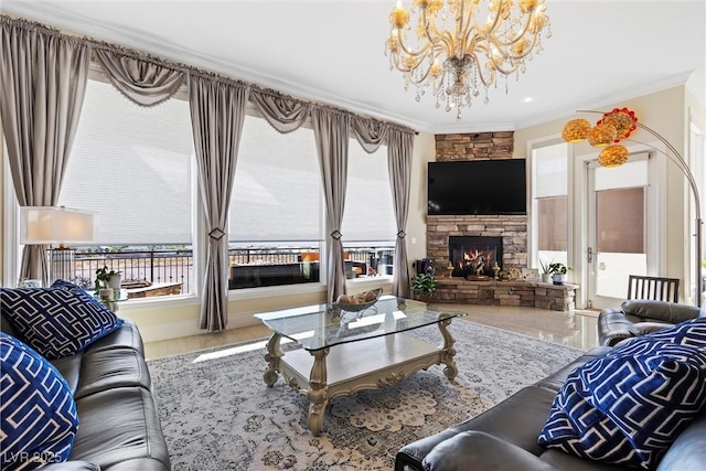 living room featuring ornamental molding, an inviting chandelier, a stone fireplace, and hardwood / wood-style floors