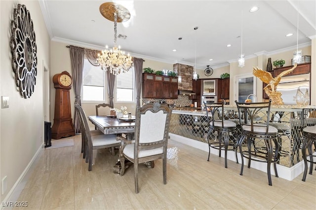 dining room featuring a notable chandelier and crown molding