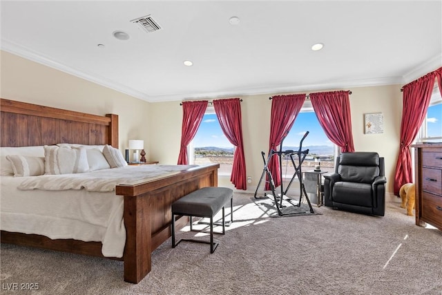 bedroom with multiple windows, carpet floors, and ornamental molding