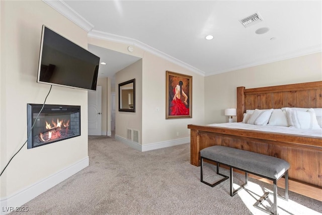 carpeted bedroom with vaulted ceiling and ornamental molding