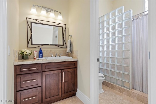 bathroom with tile patterned floors, vanity, and toilet