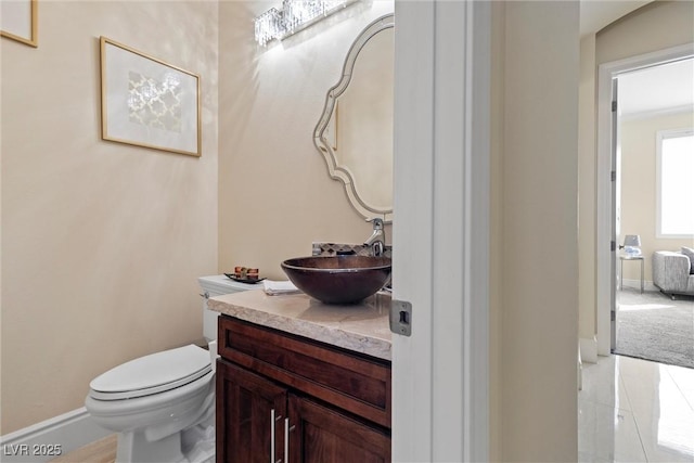 bathroom featuring vanity and toilet