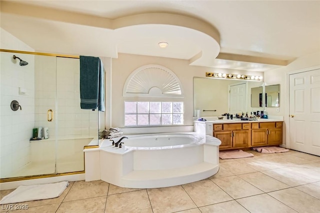 bathroom with plus walk in shower, tile patterned flooring, and vanity