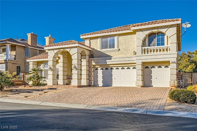 mediterranean / spanish house featuring a garage