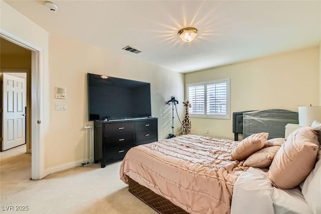 bedroom with light colored carpet