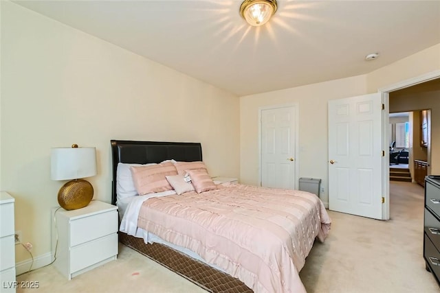 bedroom featuring light carpet