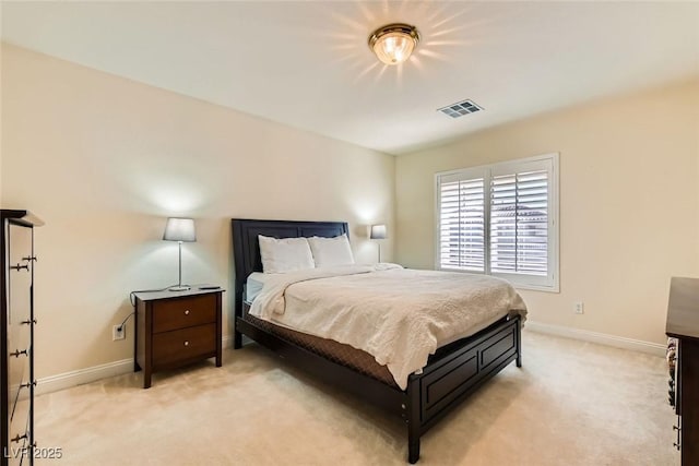 bedroom featuring light colored carpet