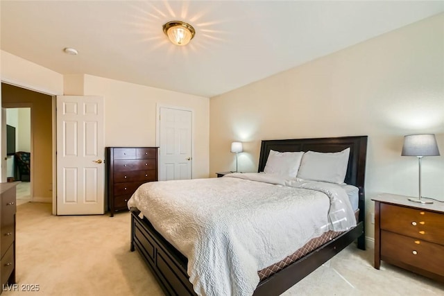 bedroom featuring light colored carpet