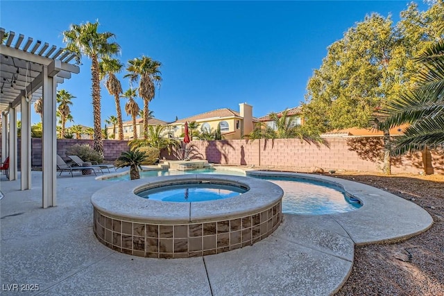 view of pool with an in ground hot tub and a patio