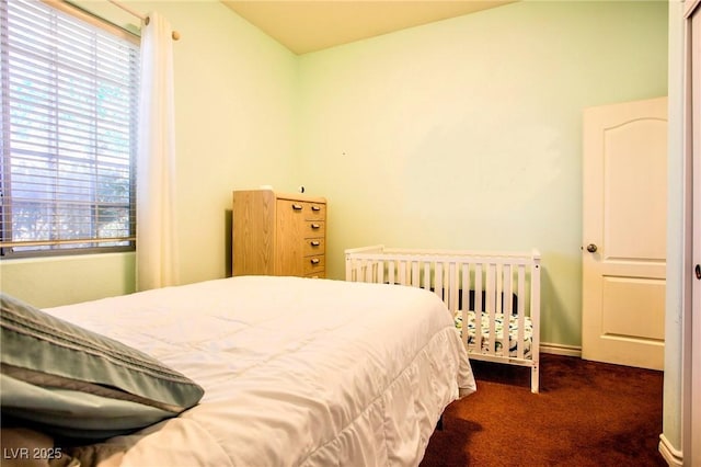 bedroom with dark carpet