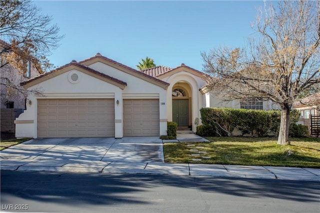 mediterranean / spanish-style home featuring a garage and a front yard