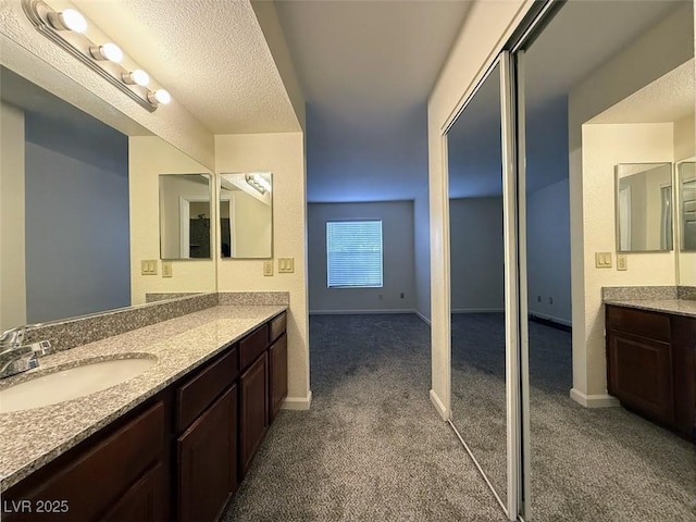 bathroom with vanity and a textured ceiling