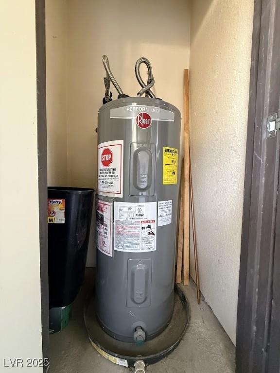 utility room featuring water heater