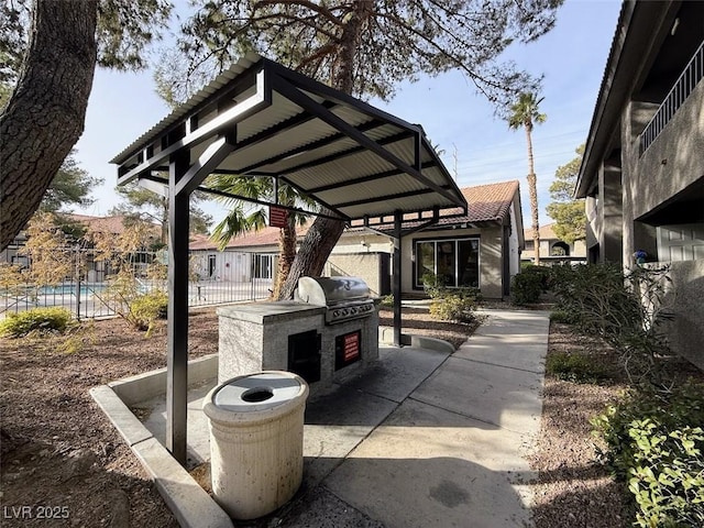 view of patio featuring grilling area and exterior kitchen