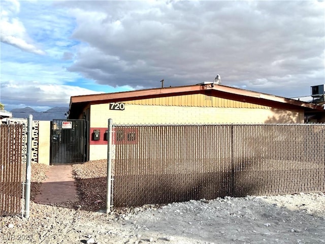 view of side of property with a mountain view