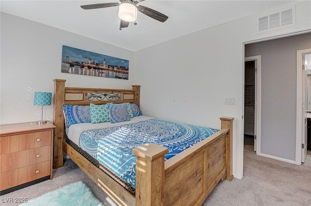 bedroom featuring light colored carpet and ceiling fan