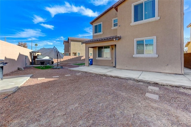 rear view of house with a patio area