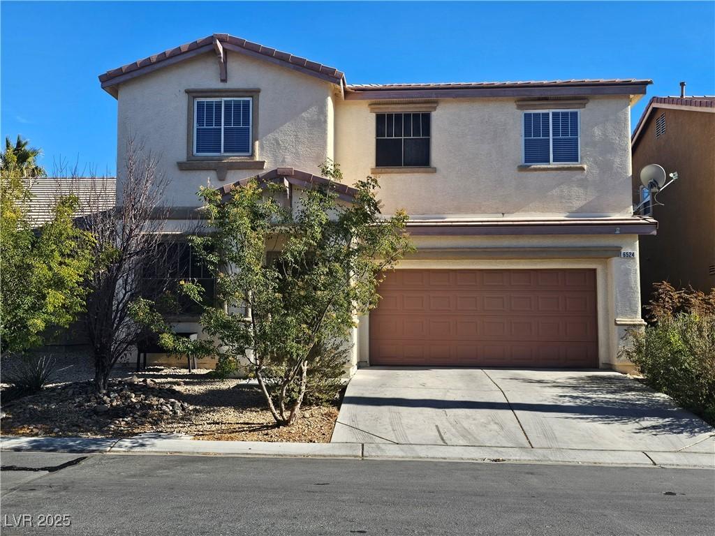 view of front of property featuring a garage