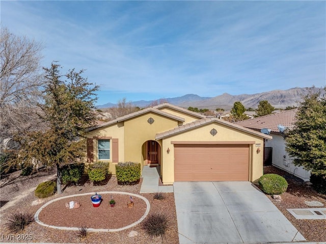 view of front of house featuring a mountain view and a garage