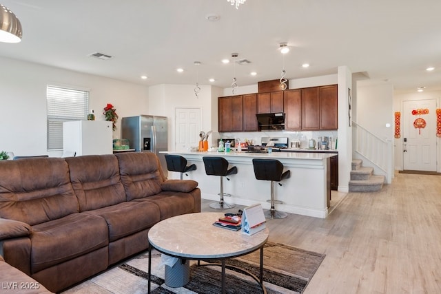 living room featuring light hardwood / wood-style flooring