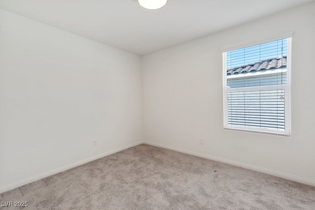 empty room featuring light colored carpet