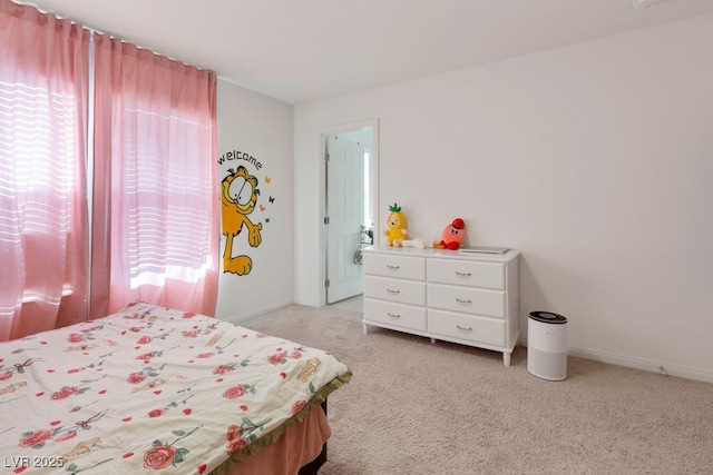 bedroom featuring multiple windows and light colored carpet