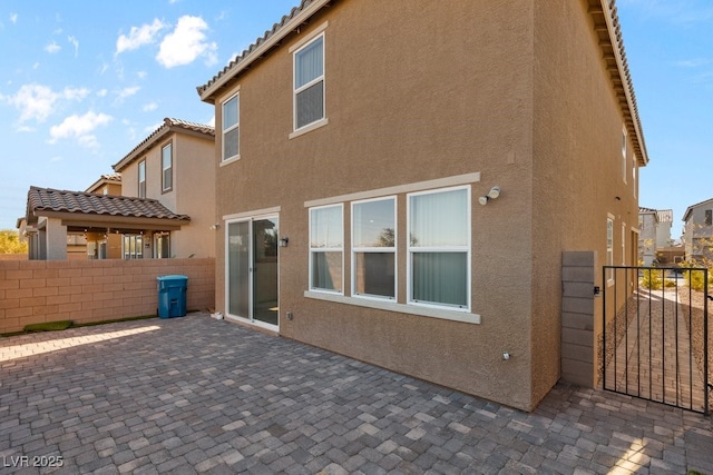 rear view of house featuring a patio area