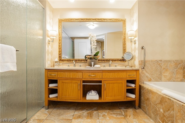 bathroom featuring shower with separate bathtub, vanity, and tile walls