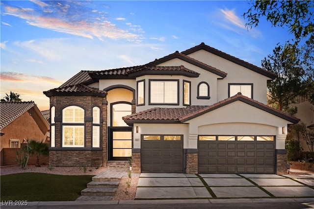 mediterranean / spanish house featuring a garage