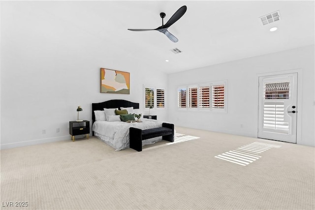 carpeted bedroom with vaulted ceiling and ceiling fan