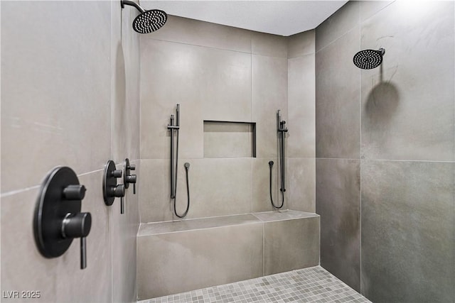 bathroom with tiled shower