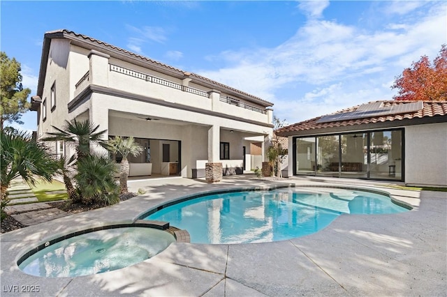 view of pool featuring an in ground hot tub and a patio