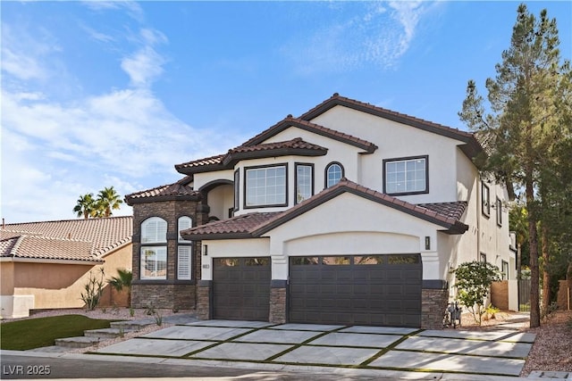 mediterranean / spanish house featuring a garage