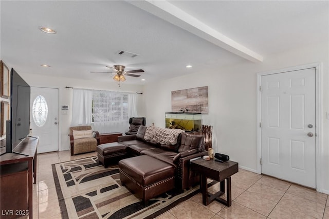 tiled living room featuring beam ceiling and ceiling fan