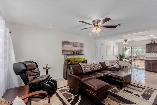 living room with light tile patterned floors and ceiling fan