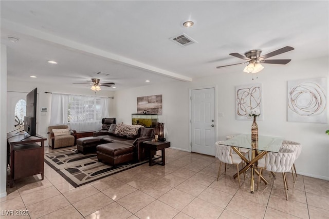 tiled living room featuring ceiling fan and beam ceiling