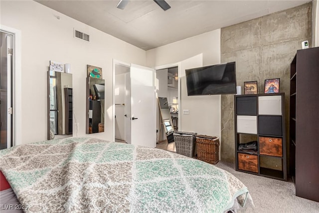 bedroom with carpet, visible vents, and ceiling fan