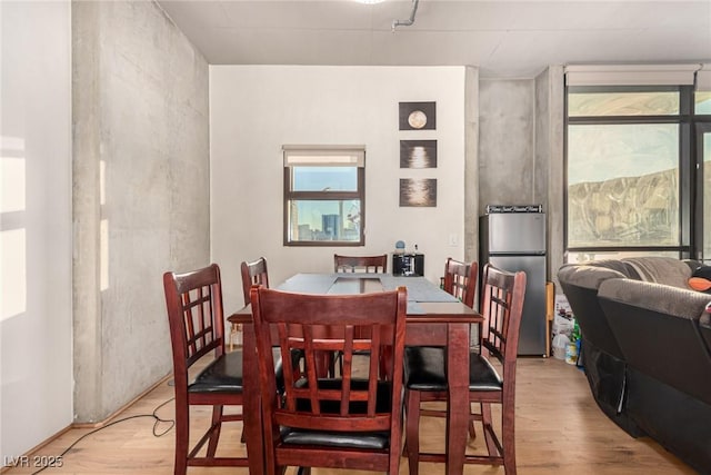 dining area featuring light wood-style floors