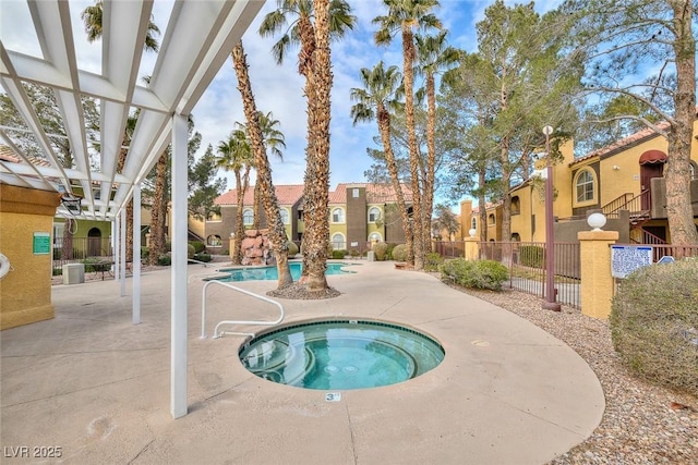 view of swimming pool featuring a pergola, a patio area, and a hot tub