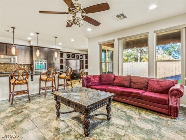 living room featuring ceiling fan