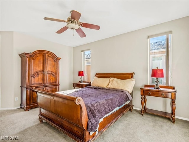 bedroom featuring ceiling fan and light carpet