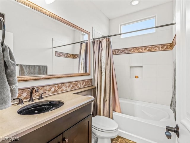 full bathroom with shower / tub combo with curtain, vanity, and toilet